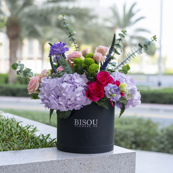 Mona flower bouquet arranged in a drum shaped box