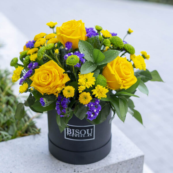 sunny flower bouquet arranged in a drum box