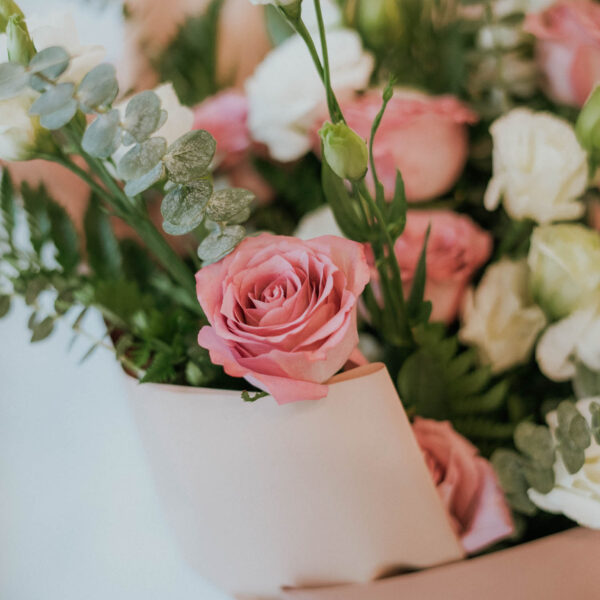 Bouquet of 14 stems of purple roses and white lisisanthes and 2 stems of white Delphinium
