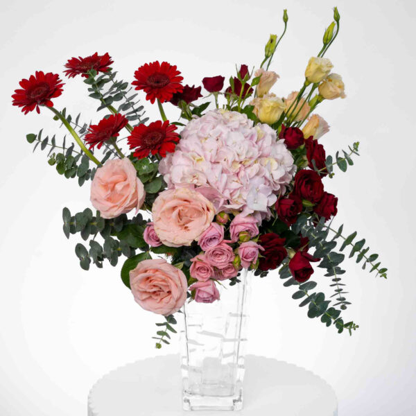 Joyful Moments flowers arranged in a glass vase
